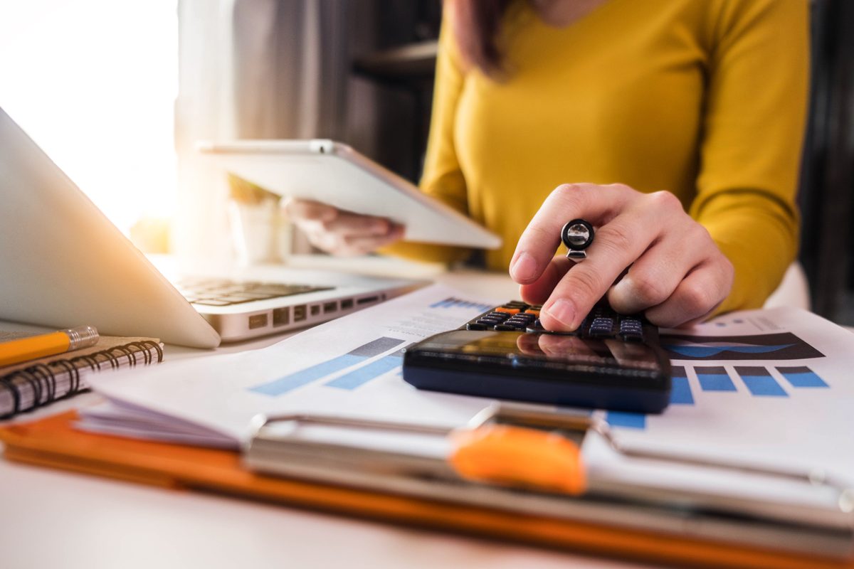 A friendly accountant smiling in a bright home office